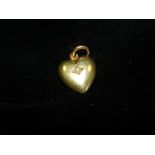 A seed pearl set heart shaped yellow met