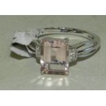 A pale pink topaz and diamond dress ring