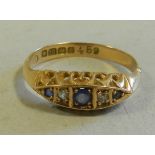 An 18 carat gold five stone sapphire and diamond ring. CONDITION REPORT: weight 3gms