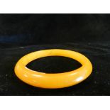 A reconstituted amber bangle.*