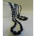 A faceted jet bead necklace.