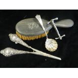 A pair of silver handled glove stretcher