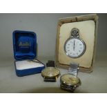 A white metal pocket watch together with