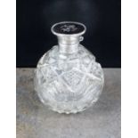 A silver and tortoiseshell mounted glass