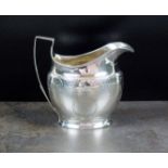 A George III silver cream jug, makers ma