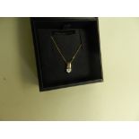 A heart shaped diamond set pendant suspe