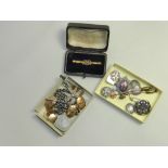 A cased seed pearl set bar brooch stampe