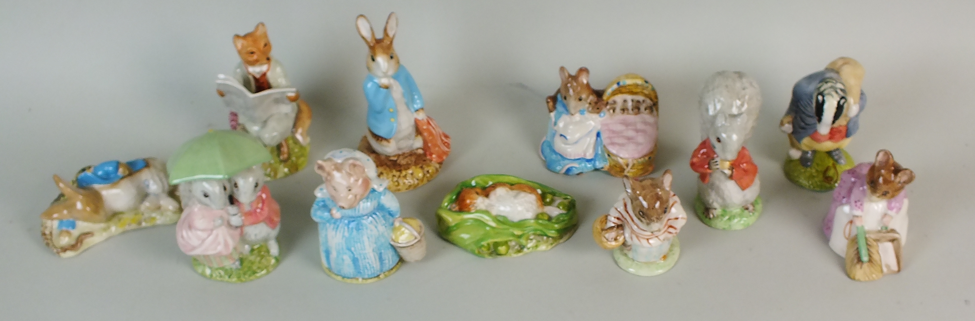 A collection of eleven Royal Albert Beatrix Potter figures, comprising 'Timmy Willie Sleeping',