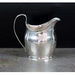 A George III silver cream jug, A*GB, London 1802, of oval form with engraved initial to the body