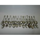 A collection of various silver fiddle pattern teaspoons and spoons, various makers and dates, to