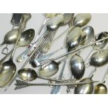 A collection of silver and white metal spoons, together with lobster picks, various dates and