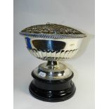 A silver plated rose bowl on ebonised base