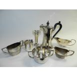 A two handled silver sugar bowl, together with a silver cream jug, a silver pierced posy vase and