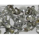 A collection of various miscellaneous silver and white metal spoons to include a sauce ladle