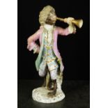 A Meissen monkey band figure, late 19th/early 20th century, modelled wearing pink coat and holding