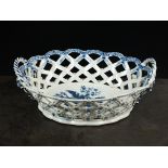 A Caughley oval basket, circa 1776-80, the diamond pierced tapering sides with flower head