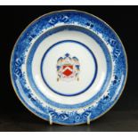 A Caughley armorial muffin dish, circa 1790, painted with the family coat of arms of the