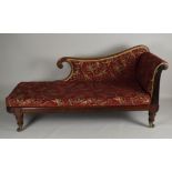 An early Victorian rosewood scroll end chaise longue, on four short turned legs terminating in