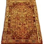 A Northwest Persian design salmon and cream ground rug with stylized floral border 215cm x 145cm