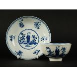 A Caughley tea bowl and saucer, circa 1778, painted in blue with the 'Waiting Chinaman' pattern and