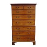 A late George III mahogany chest on chest, the dentil moulded cornice over two short and six long