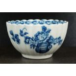 A Caughley fluted tea bowl, circa 1778-88, transfer-printed in underglaze blue with the Fruit and