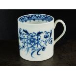 A Caughley coffee can, circa 1776-79, with grooved strap handle, painted in underglaze blue with