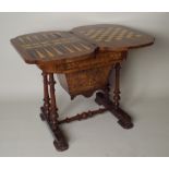 A mid Victorian figured walnut and marquetry fold-over games / work table, the hinged marquetry