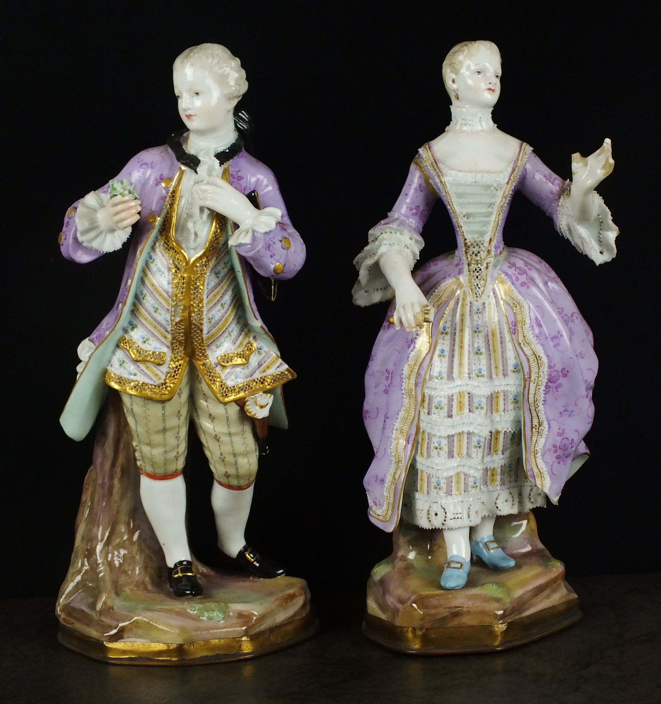 A pair of Continental porcelain figures, late 19th/early 20th century, modelled as a lady and