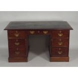 A 19th century mahogany pedestal kneehole desk the rectangular top with leather insert and moulded