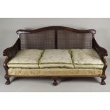 An early 20th century mahogany Chippendale style double bergere suite the two seater settee with