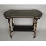 A Victorian ebonised Aesthetic writing table, with gilt highlighting and green tooled leather inset