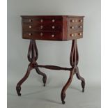 A Regency mahogany crossbanded work table, the rectangular top with cut-off corners over three