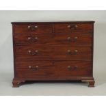 A George III mahogany chest of two short over three long graduated  cockbeaded drawers fitted with