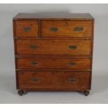 An 19th century teak secretaire campaign chest, with brass corner protectors and flush fitting