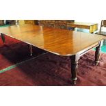 An early Victorian mahogany pull-out dining table, the rectangular top with rounded corners and
