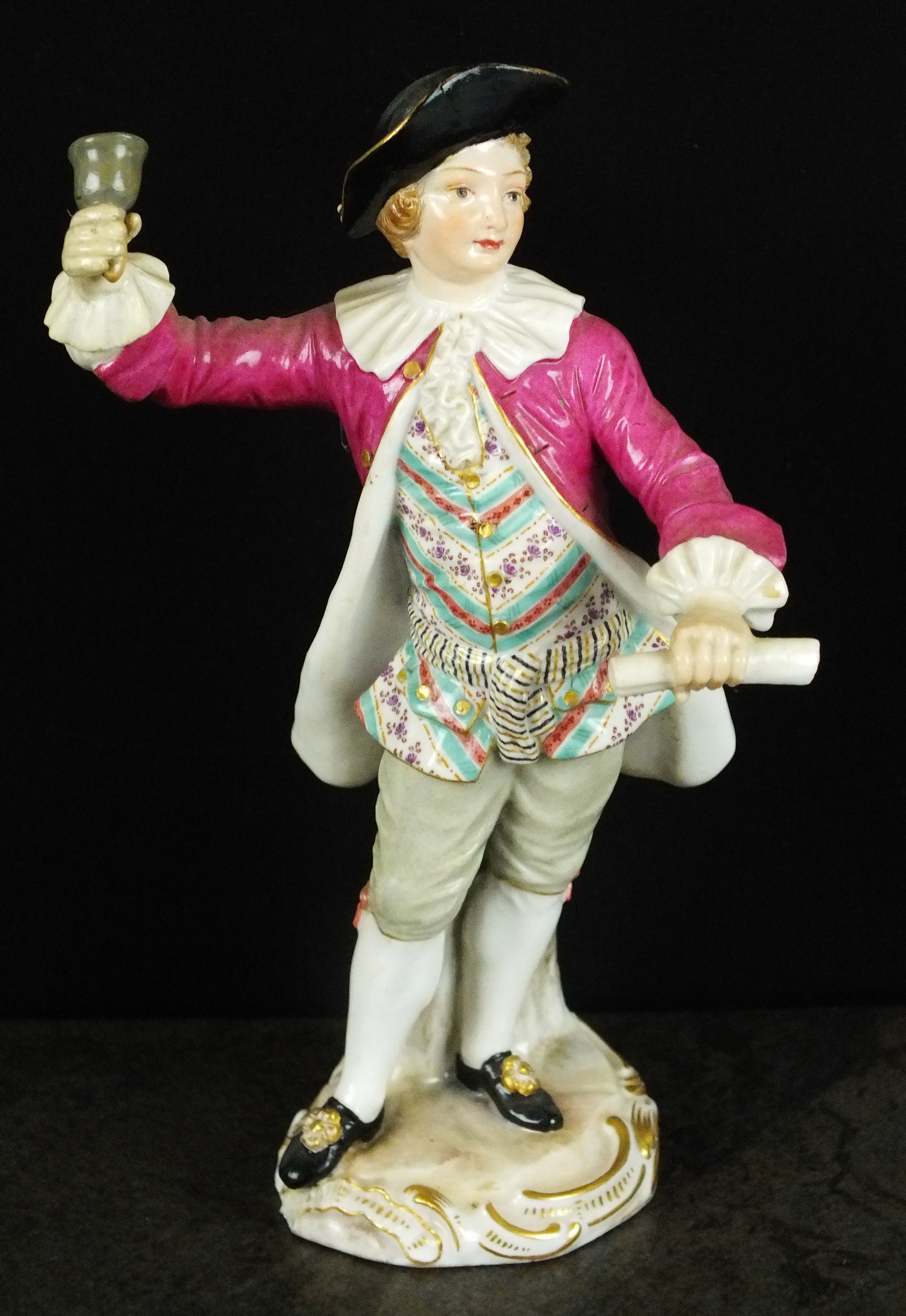 A Meissen porcelain figure of a Town Crier, late 19th/early 20th century, modelled with a bell in