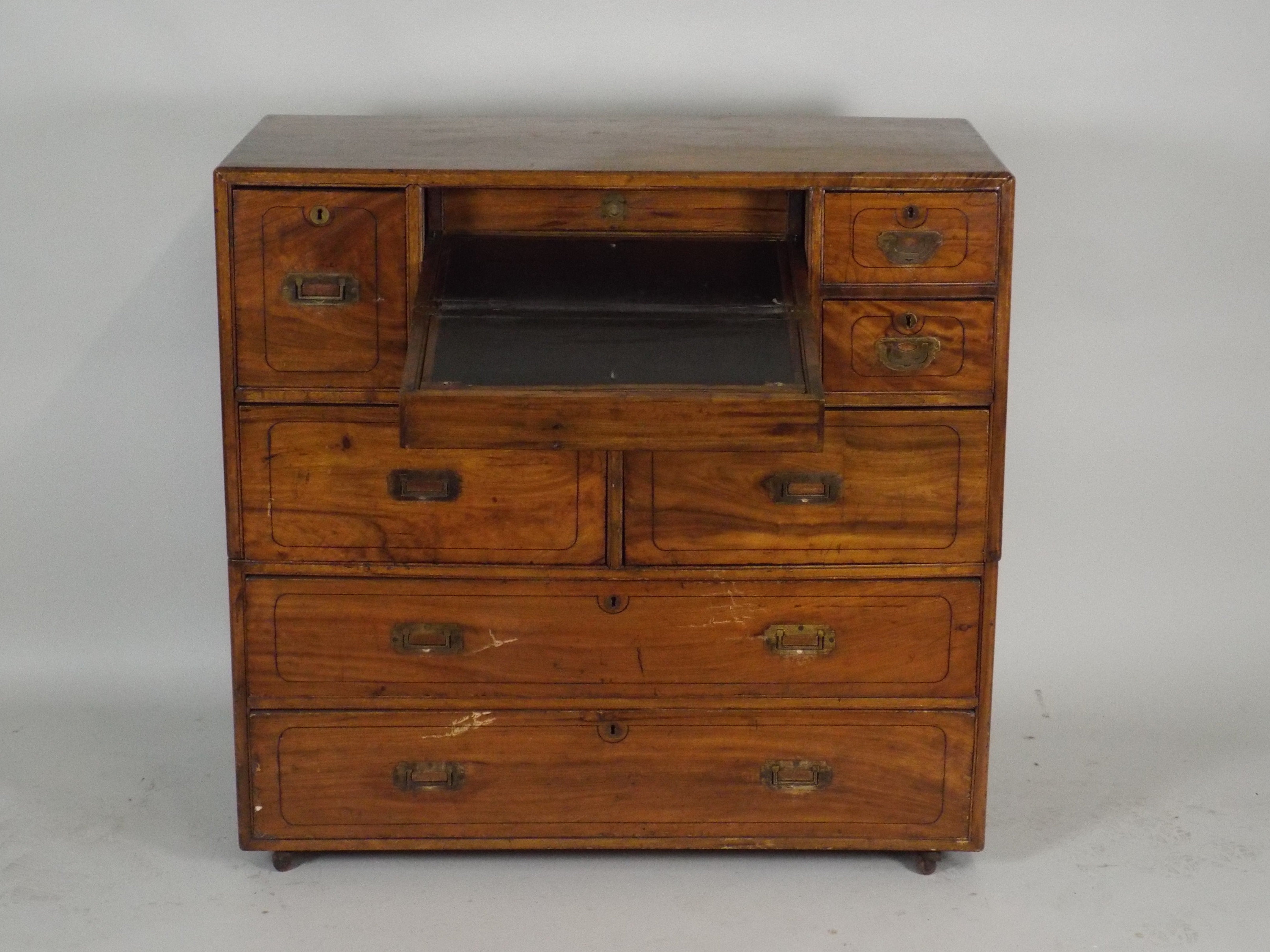 A 19th century teak campaign style desk/chest, the rectangular top with rounded edges over a central - Image 2 of 2
