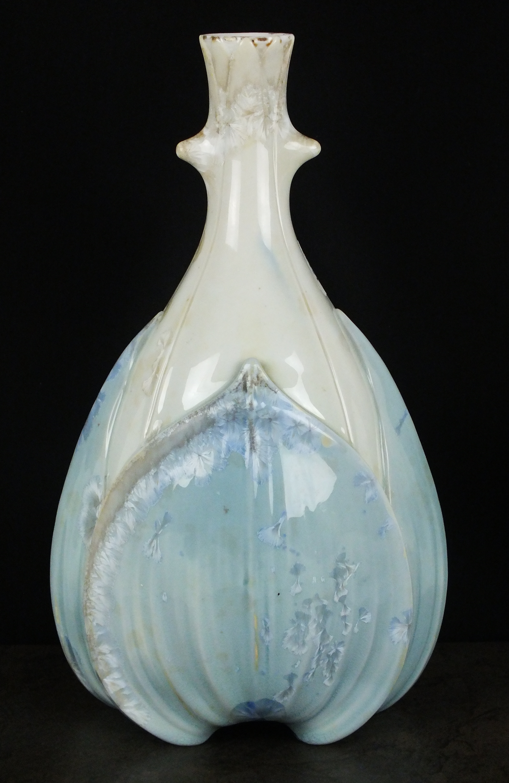 A pale blue Sevres crystalline vase, dated 1907, of lobed form, with the main body decorated in the