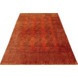 A late 20th century red ground Turkestan carpet 210cm x 310cm