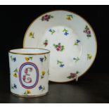 A 'Sevres' coffee-can and saucer (gobelet litron et soucoupe), painted with pink, yellow and blue