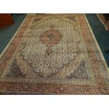 A cream ground Indian design 20th century carpet