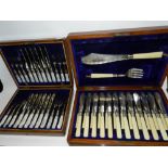 A cased set of twelve mother of pearl handled fruit knives with silver ferrules hallmarked