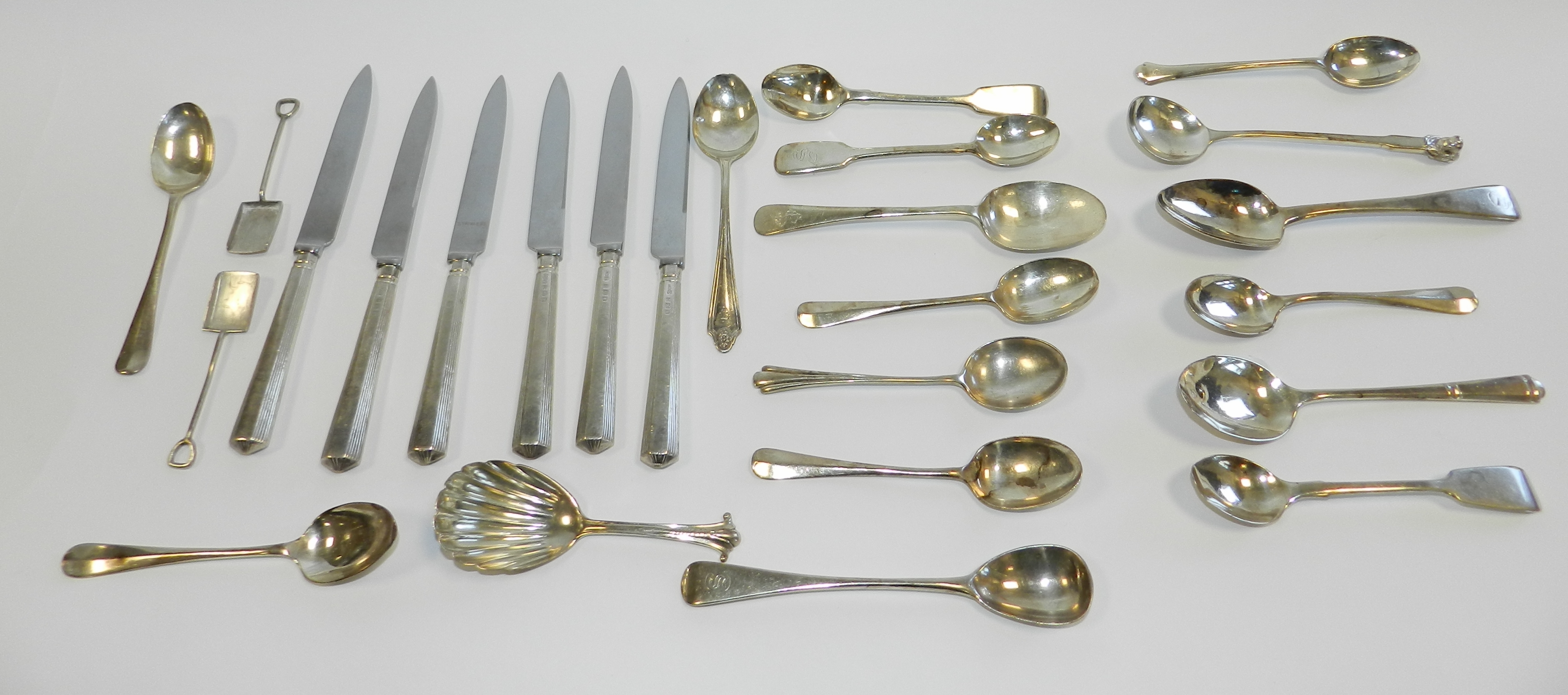 Six silver handled side knives together with a collection of various silver spoons and two silver
