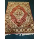 A modern Kum red ground rug approx 1m 90cm x 1m 40cm*