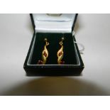 A pair of 9ct gold ruby set stylised ear pendants*