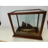 A model boat in presentation case*