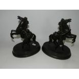 A pair of spelter Marley horse figure groups after Couston