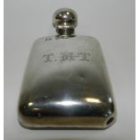 A silver hip flask hallmarked London with engraved initials 'T M T'