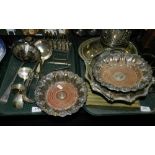 Silver-plated wares to include a bottle coaster on four feet, a toast rack, knife rests, flatware,